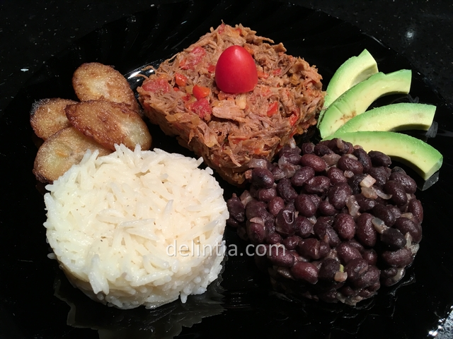Venezuelan dish with pulled beef rice and black bean
